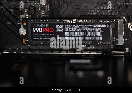 Lviv, Ukraine - October 30, 2024: Samsung SSD 990 PRO PCle 4.0 NVMe M.2 on motherboard background Stock Photo