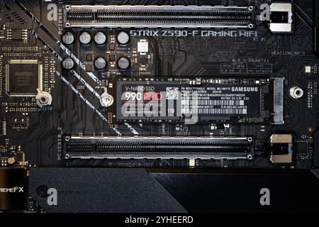 Lviv, Ukraine - October 30, 2024: Samsung SSD 990 PRO PCle 4.0 NVMe M.2 on motherboard background Stock Photo