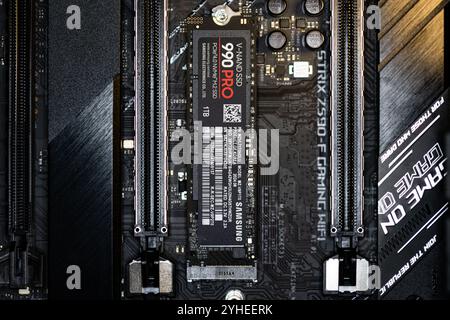 Lviv, Ukraine - October 30, 2024: Samsung SSD 990 PRO PCle 4.0 NVMe M.2 on motherboard background Stock Photo