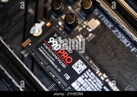 Lviv, Ukraine - October 30, 2024: Samsung SSD 990 PRO PCle 4.0 NVMe M.2 on motherboard background Stock Photo