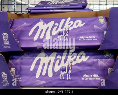 Italy - November 11, 2024: Milka chocolate bar in lilac-coloured packaging on the shelf in an Italian supermarket, Milka is Swiss Chocolate of the Mon Stock Photo