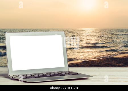 laptop with blank screen on wooden table Stock Photo
