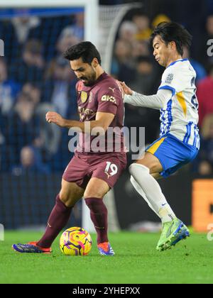 Brighton, UK. 09th Nov, 2024. Brighton, England - November 9: Brighton & Hove Albion's Kaoru Mitoma (right) battles with Manchester City's İlkay Gündogan (left) during the Premier League 2024/25 match between Brighton and Hove Albion vs Manchester City at Amex Stadium on November 9, 2024 in Brighton, England. (David Horton/SPP) Credit: SPP Sport Press Photo. /Alamy Live News Stock Photo