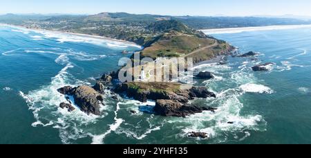 The Yaquina Head Lighthouse stands along the scenic and rugged coastline of Newport, Oregon. This beautiful 93 foot tall lighthouse was built in 1872. Stock Photo