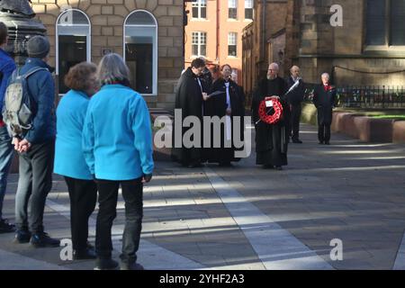 Armistice Day, Newcastle Cathedral, St Nicholas Square, People gather for the anniversary of the Armistice signing with the Reverend Canon Lee Batson,The Dean of Newcastle who lead a short act of remembrance, followed by the laying of poppies, Newcastle upon Tyne, UK, November 11th, 2024, Credit: DEW/Alamy Live News Stock Photo