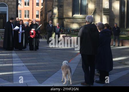 Armistice Day, Newcastle Cathedral, St Nicholas Square, People gather for the anniversary of the Armistice signing with the Reverend Canon Lee Batson,The Dean of Newcastle who lead a short act of remembrance, followed by the laying of poppies, Newcastle upon Tyne, UK, November 11th, 2024, Credit: DEW/Alamy Live News Stock Photo