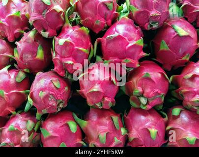 Fresh ripe red Dragon fruit, Pitaya fruit, produce market, Bangkok, Thailand Stock Photo