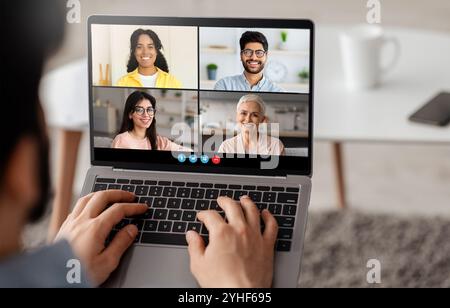 Virtual meeting with diverse participants discussing projects online Stock Photo