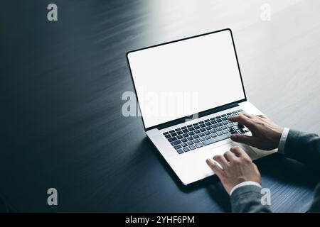 Man using laptop. Mockup of the screen Stock Photo