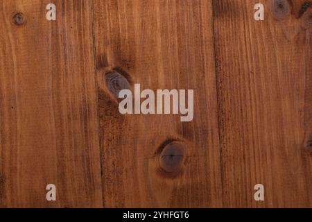 Elegant dark wooden panel with distinctive knots and deep rich textures Stock Photo
