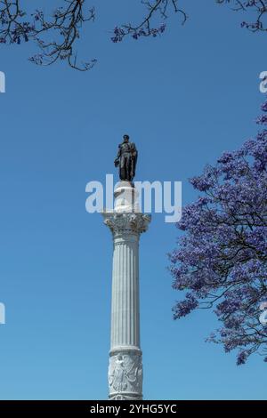 Monument of King Dom Pedro IV in Rossio Square, central and lively Lisbon square, with wavy paving in the city of Lisbon, capital of Portugal, Europe Stock Photo