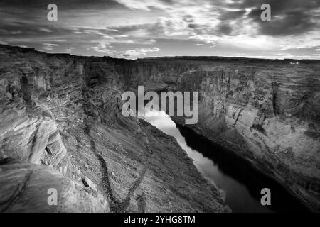 The Colorado River flowing through Glen Canyon below moonlight. Stock Photo