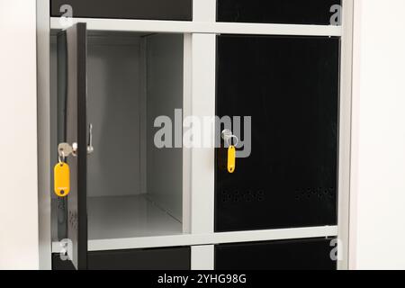 Modern lockers with bright keys indoors, closeup Stock Photo