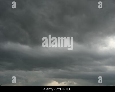 Cumulonimbus cloud formations on tropical sky , Nimbus moving , Abstract background from natural phenomenon and gray clouds hunk , Thailand Stock Photo