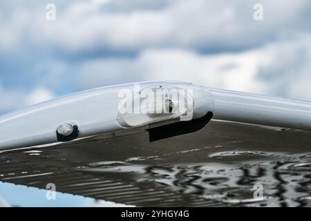 Navigational lights on an aircraft wing Stock Photo
