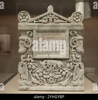 Roman urn of Tiberius Claudius Chryseuros,  Iulia Theonoes and Claudia Dorcas. Decorated with god Ammon, wolf with the twins, eagles. Rome. 1st-2nd ce Stock Photo