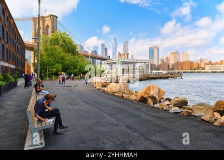 Ney York, USA-August 07, 2017 :  View from the embankment to Brooklyn Bridge  between the Manhattan and Brooklyn. Stock Photo