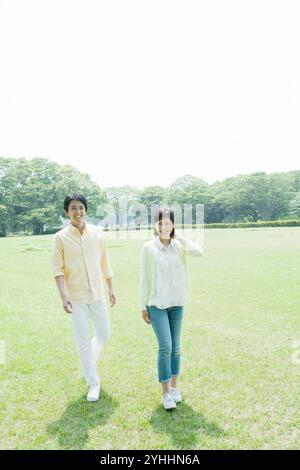 Japanese Couple Taking A Walk In The Park Stock Photo - Alamy