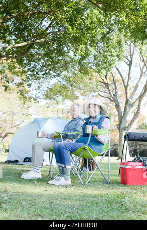 Senior couple having a picnic in the park Stock Photo
