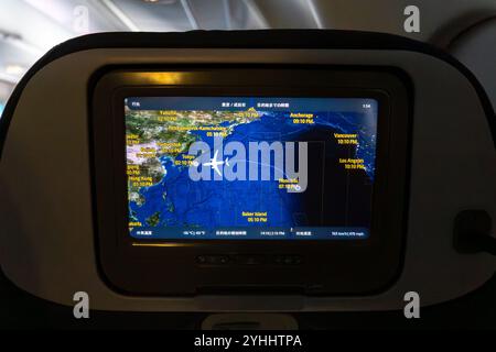 Flight tracking display shows airplane route over the Pacific Ocean ...