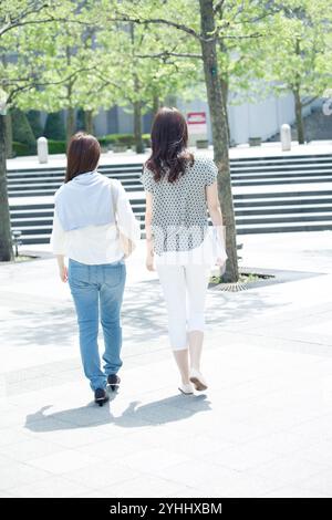 Business image of a woman in her 20s using a smartphone Stock Photo