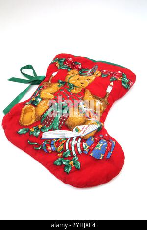 Teddy Bear with gifts on a Red Christmas Stocking Stock Photo