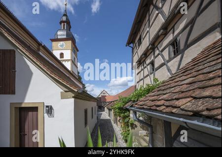 Inner courtyard with wine cellars and St John's Church in the historic fortified church, Huettenheim, Lower Franconia, Bavaria, Germany, Europe Stock Photo