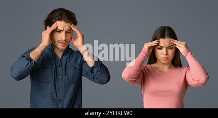 Asian young couple having headache cause of fight, touching their heads, panorama with copy space Stock Photo