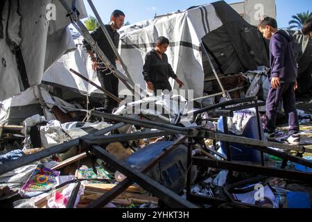 Middle East news.War Gaza Palestinians inspect the damage following Israeli bombardment which hit a camp for displaced people from other parts of northern Gaza inside the Al-Jazira Sports Club in Gaza City on November 12, 2024. The Gaza Strip Palestine Copyright: xMahmoudxIssax IMG 2353 Stock Photo