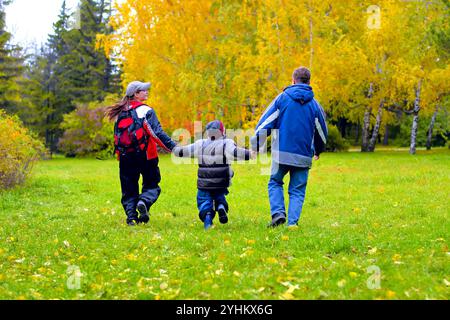 happy teenagers walking in the autumn park Stock Photo