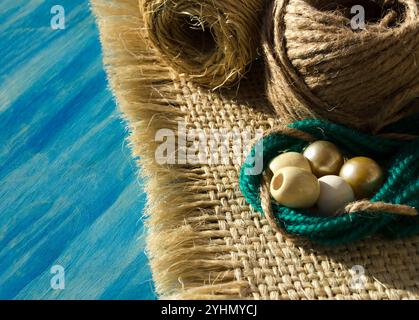 Rope of straw for weaving macrame on a wooden background. Hobby, needlework. weaving macrame. Stock Photo