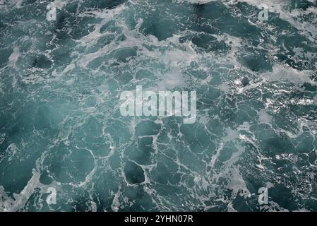 Turbulent water created by a ship at sea. Stock Photo
