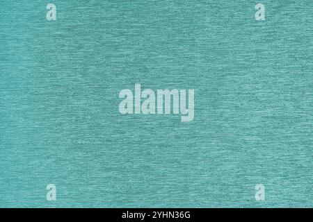 Closeup, macro of turquoise fabric texture background. Satin weaving cloth structure, canvas. Textile for decor, upholstery, garment. Wallpaper, backd Stock Photo