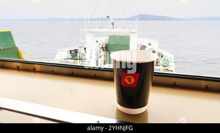 Take away coffee in paper cup on Caledonian Macbrayne ferry Stock Photo