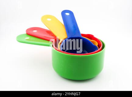 Colourful plastic kitchen measures on white background Stock Photo