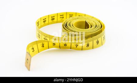 Loose metric measuring tape on white background Stock Photo