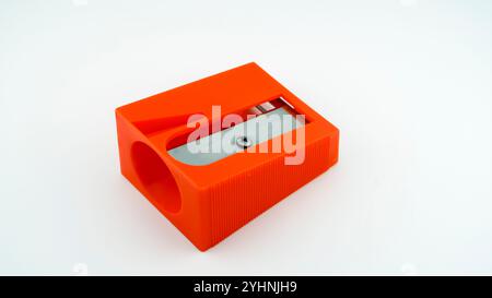 Carrot peeler in style of large pencil sharpener on white background Stock Photo
