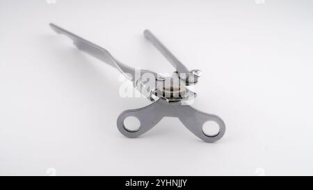 traditional simple hand can opener on white background Stock Photo