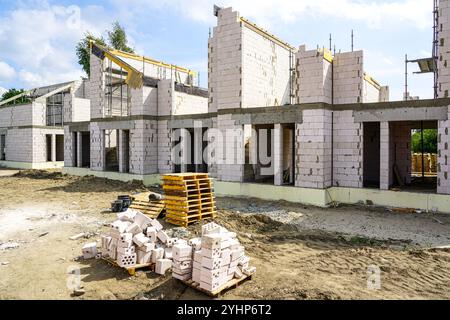 Construction site of a new residential terraced house from expanded clay blocks with concrete covers and thermally insulated foundations Stock Photo