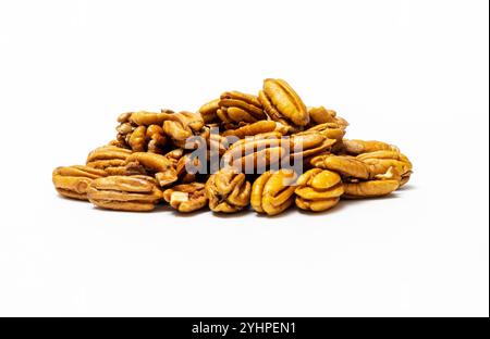 Pile Pecan nuts isolated on white background. Heap shelled Pecans nut closeup. Tasty raw organic food and healthy snack Stock Photo