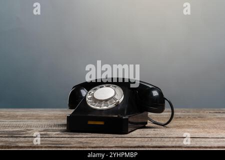 Vintage phone on a wooden table Stock Photo