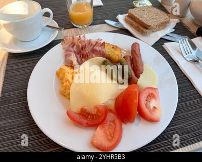 Plate of buffet food hotel breakfast self-served on table, Poland Stock Photo