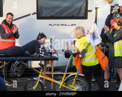 TV celebrity Paddy McGuinness during the second leg of his gruelling 300 mile ride for BBC Children in Need charity appeal on a physiotherapists bench Stock Photo