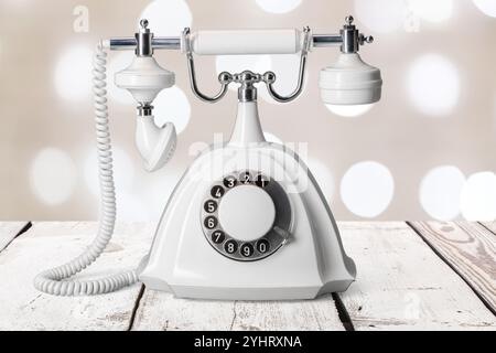 Vintage phone on a wooden table Stock Photo