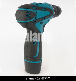 Cordless screwdriver on light background rear view. Stock Photo
