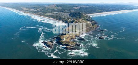 The Yaquina Head Lighthouse stands along the scenic and rugged coastline of Newport, Oregon. This beautiful 93 foot tall lighthouse was built in 1872. Stock Photo