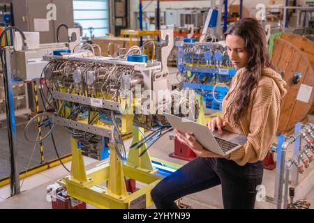 Computer scientist Gabriella Azzopardi developing collimation software at CERN (European Organization for Nuclear Research). She develops the collimation software used in the CERN Control Center to move all collimators in the Large Hadron Collider (LHC). Stock Photo