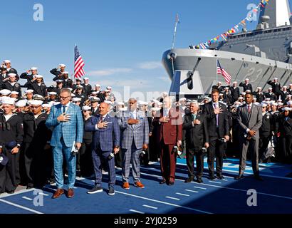 San Diego, Ca, USA. 10th Nov, 2024. From left, Howie Long, Jay Glazer, Curt Menefee, Terry Bradshaw, Jimmy Johnson, Rob Gronkowski, and Michael Strahan stand for the national anthem as the FOX NFL Sunday crew broadcasted from a pier at Naval Base San Diego in front of hundreds of sailors on Sunday, November 10, 2024. (Credit Image: © K.C. Alfred/ZUMA Press Wire) EDITORIAL USAGE ONLY! Not for Commercial USAGE! Stock Photo