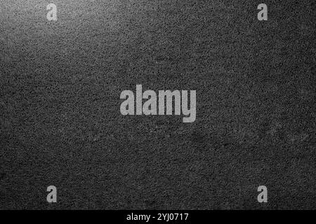 Closeup view of black doormat. Seamless pattern of black carpet. Mockup. Copy space. Dark texture background Stock Photo