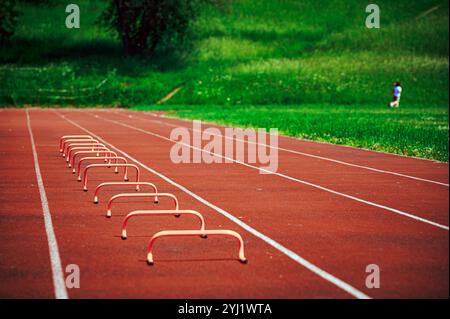 Athletic Training Equipment for Kids on Outdoor Track at Scenic Stadium Stock Photo